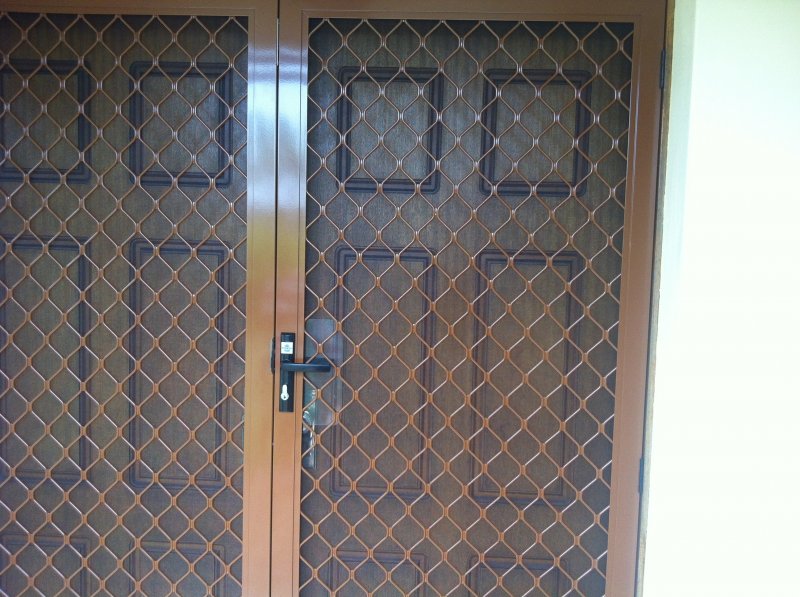 Welded Diamond French security Doors in sunburst pearl